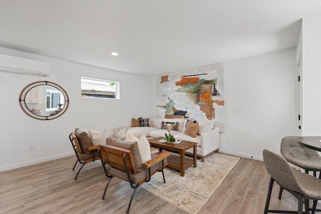 1912 W Buckeye Ave, Spokane, WA 99205 - living room featuring a wall mounted AC, light wood finished floors, baseboards, and recessed lighting