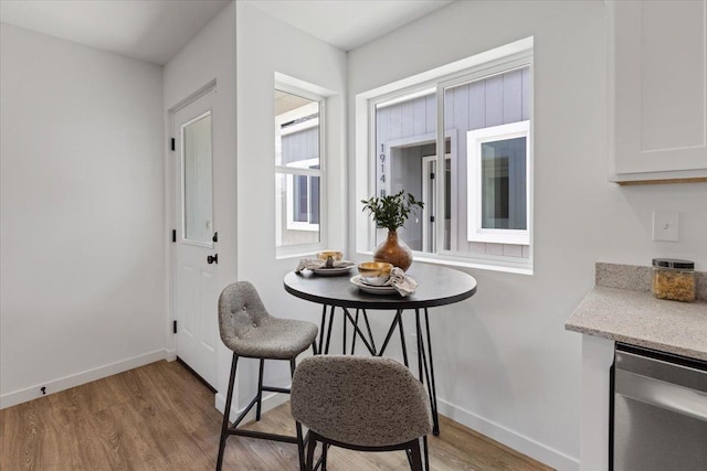 1912 W Buckeye Ave, Spokane, WA 99205 - dining room featuring light wood-type flooring and baseboards