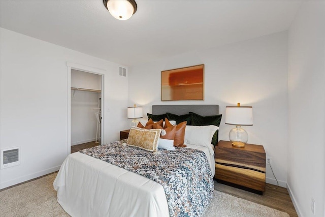 1912 W Buckeye Ave, Spokane, WA 99205 - bedroom with baseboards, a closet, and wood finished floors
