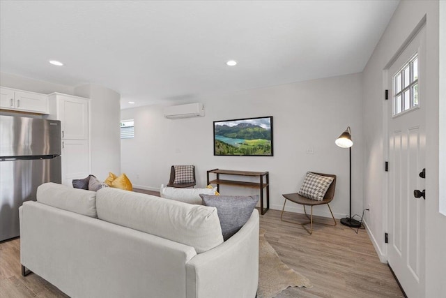 1912 W Buckeye Ave, Spokane, WA 99205 - living room featuring a wall mounted AC, light wood-type flooring, baseboards, and recessed lighting