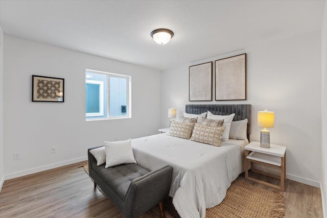 1912 W Buckeye Ave, Spokane, WA 99205 - bedroom featuring wood finished floors and baseboards