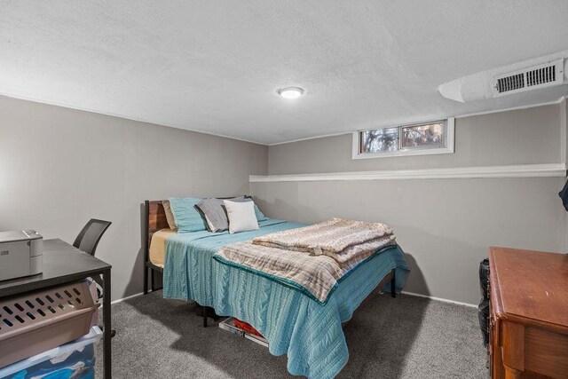 4824 N Stone St, Spokane, WA 99207 - bedroom with carpet flooring, a textured ceiling, and baseboards
