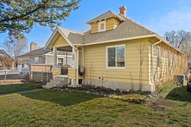 4824 N Stone St, Spokane, WA 99207 - view of front facade featuring a chimney, roof with shingles, a deck, and central air condition unit