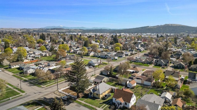 4824 N Stone St, Spokane, WA 99207 - aerial overview of property's location featuring mountains and nearby suburban area