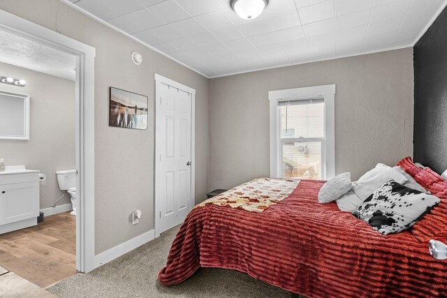 4824 N Stone St, Spokane, WA 99207 - bedroom with crown molding, baseboards, and ensuite bath