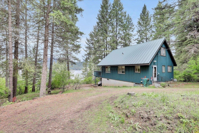 4134 Pebble Beach Rd, Loon Lake, WA 99148 - view of front of home featuring metal roof and board and batten siding