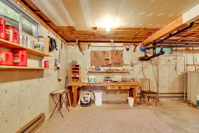 4134 Pebble Beach Rd, Loon Lake, WA 99148 - unfinished basement with a baseboard radiator and a workshop area