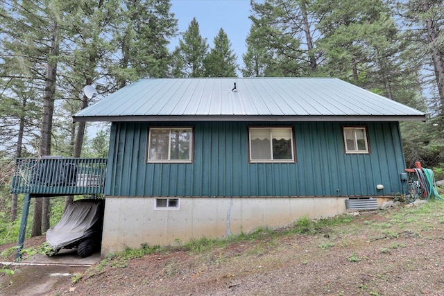 4134 Pebble Beach Rd, Loon Lake, WA 99148 - view of home's exterior featuring board and batten siding and a wooden deck