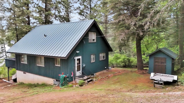 4134 Pebble Beach Rd, Loon Lake, WA 99148 - chalet / cabin featuring metal roof