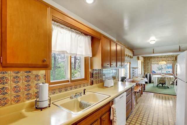 4134 Pebble Beach Rd, Loon Lake, WA 99148 - kitchen featuring white appliances, a sink, light countertops, and plenty of natural light