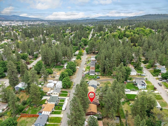 3712 E 12th Ave, Spokane, WA 99202 - view of property location with a heavily wooded area, nearby suburban area, and a mountain backdrop