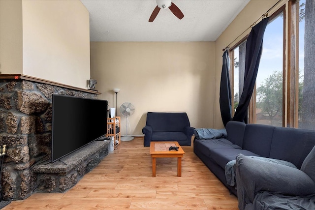 3712 E 12th Ave, Spokane, WA 99202 - living area with a ceiling fan and light wood-type flooring
