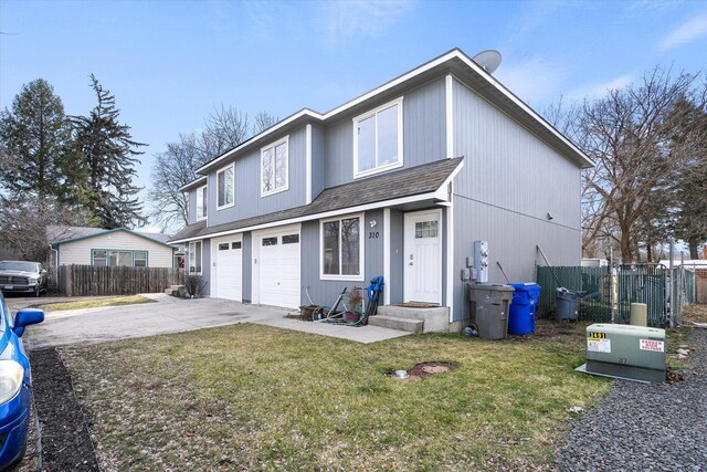 310 S Union St Unit 312, Spokane Valley, WA 99206 - view of front facade featuring concrete driveway, an attached garage, and a shingled roof
