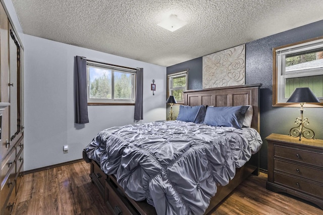 15906 N Forker Rd, Spokane, WA 99217 - bedroom featuring a textured ceiling, dark wood-type flooring, and baseboards