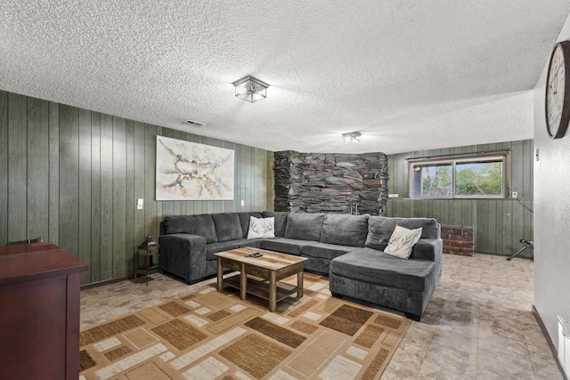 15906 N Forker Rd, Spokane, WA 99217 - living area with wooden walls, a textured ceiling, and a fireplace