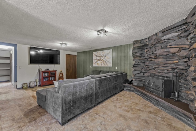 15906 N Forker Rd, Spokane, WA 99217 - living area featuring a textured ceiling and a fireplace