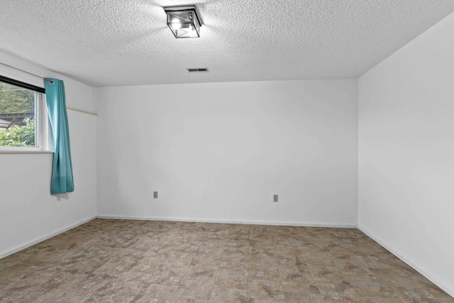 15906 N Forker Rd, Spokane, WA 99217 - unfurnished room featuring a textured ceiling