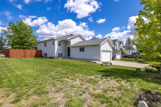 4701 E 13th Ave, Spokane Valley, WA 99212 - rear view of property featuring a garage and concrete driveway