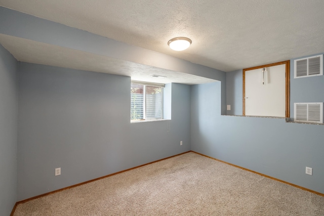 4701 E 13th Ave, Spokane Valley, WA 99212 - basement featuring baseboards, carpet floors, and a textured ceiling