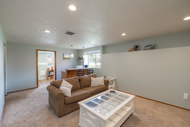 4701 E 13th Ave, Spokane Valley, WA 99212 - living room featuring light colored carpet, recessed lighting, and baseboards
