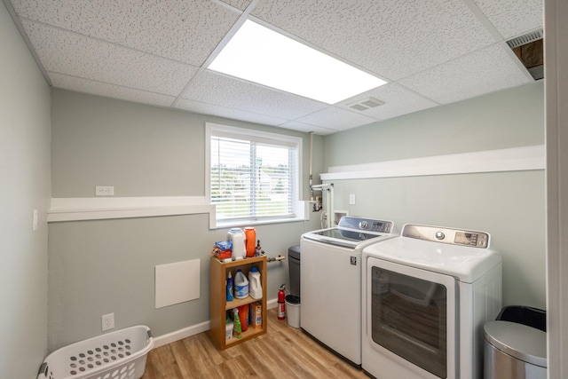 4701 E 13th Ave, Spokane Valley, WA 99212 - laundry area featuring washing machine and dryer and light wood-type flooring