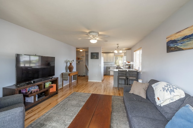 4701 E 13th Ave, Spokane Valley, WA 99212 - living area with light wood finished floors, a chandelier, and ceiling fan