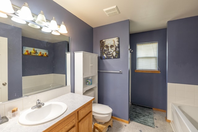 4701 E 13th Ave, Spokane Valley, WA 99212 - full bath featuring a garden tub, vanity, toilet, and baseboards