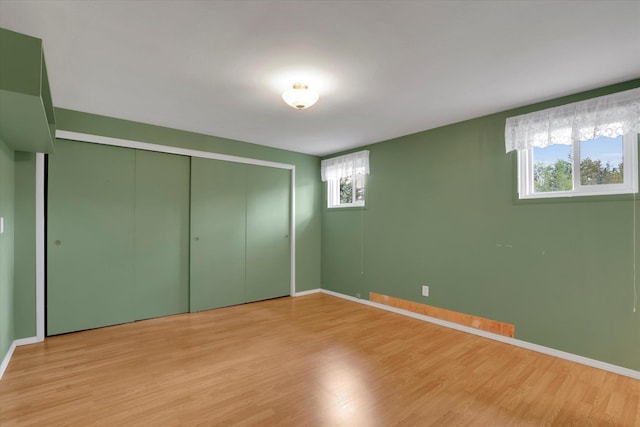 2111 W Mason Rd, Deer Park, WA 99006 - unfurnished bedroom featuring light wood finished floors, baseboards, and a closet