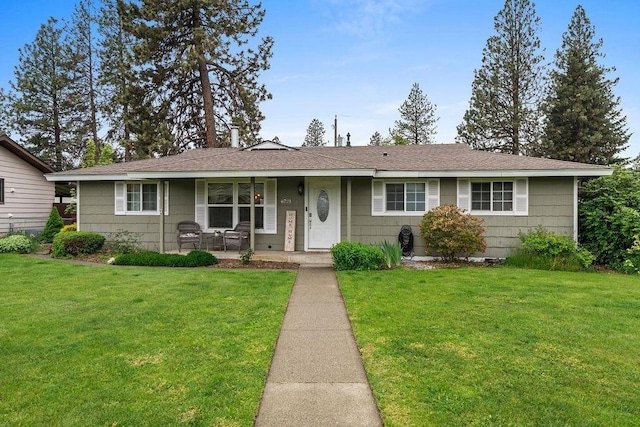6721 N Washington St, Spokane, WA 99208 - single story home with a porch, a front lawn, and a shingled roof