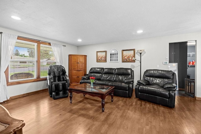 6721 N Washington St, Spokane, WA 99208 - living area with wood finished floors, a textured ceiling, and recessed lighting