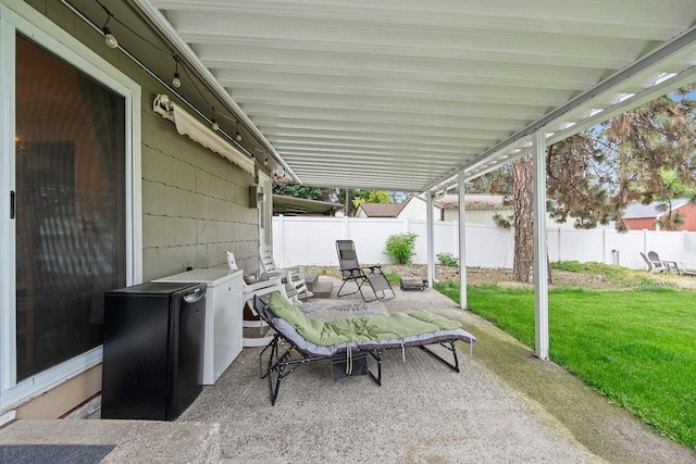 6721 N Washington St, Spokane, WA 99208 - fenced backyard with a patio