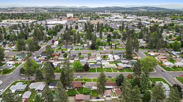 6721 N Washington St, Spokane, WA 99208 - aerial view of property and surrounding area featuring a mountainous background and nearby suburban area