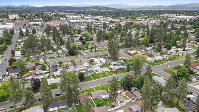 6721 N Washington St, Spokane, WA 99208 - aerial overview of property's location with mountains and nearby suburban area