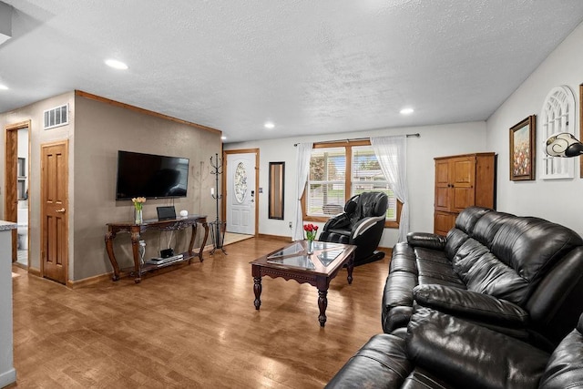 6721 N Washington St, Spokane, WA 99208 - living area with a textured ceiling, wood finished floors, and recessed lighting