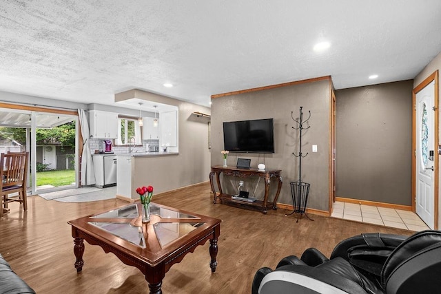 6721 N Washington St, Spokane, WA 99208 - living room with a textured ceiling, light wood-type flooring, and recessed lighting