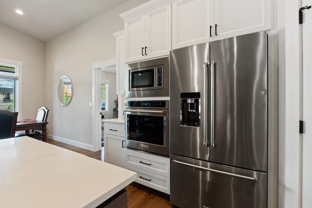7203 S Tangle Heights Dr, Spokane, WA 99224 - kitchen with stainless steel appliances, light countertops, healthy amount of natural light, dark wood-style floors, and recessed lighting