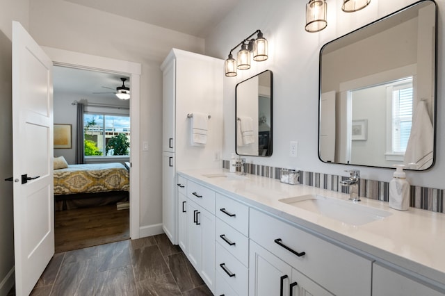 7203 S Tangle Heights Dr, Spokane, WA 99224 - ensuite bathroom with double vanity, ceiling fan, and baseboards