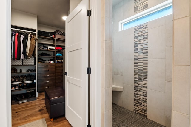 7203 S Tangle Heights Dr, Spokane, WA 99224 - full bathroom with a walk in closet, a walk in shower, and wood finished floors
