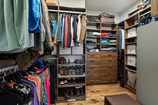 7203 S Tangle Heights Dr, Spokane, WA 99224 - walk in closet featuring wood finished floors