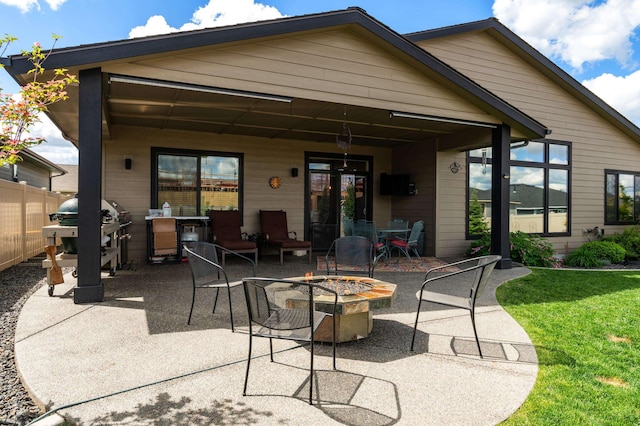 7203 S Tangle Heights Dr, Spokane, WA 99224 - back of house featuring a fire pit and a patio
