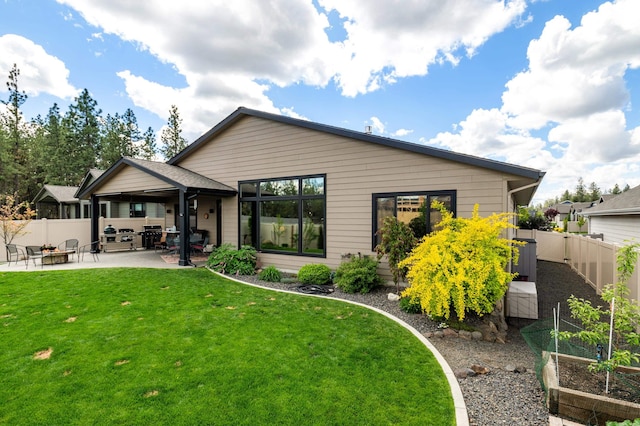 7203 S Tangle Heights Dr, Spokane, WA 99224 - back of property featuring a garden, a patio, and a fire pit