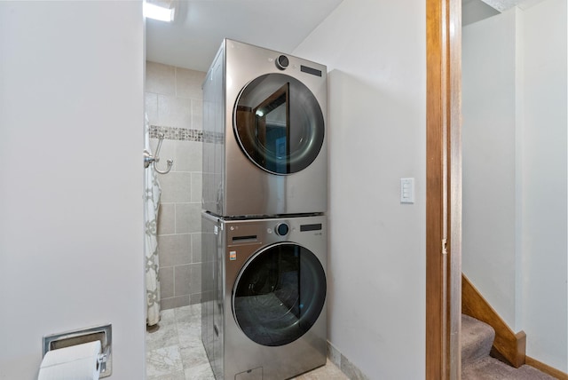 9815 E 44th Ave, Spokane Valley, WA 99206 - laundry room with stacked washer and clothes dryer and baseboards