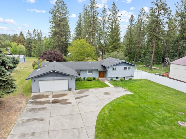 9815 E 44th Ave, Spokane Valley, WA 99206 - ranch-style house with driveway, a chimney, and a garage
