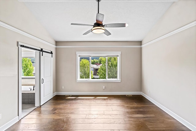 4305 S Bernson Ln, Spokane, WA 99223 - unfurnished bedroom with hardwood / wood-style flooring, a barn door, vaulted ceiling, baseboards, and ceiling fan