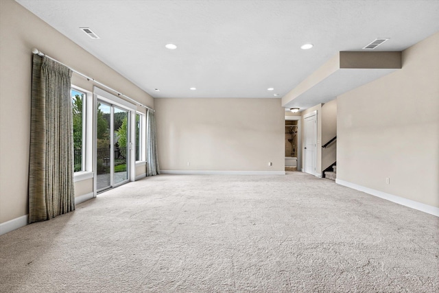 4305 S Bernson Ln, Spokane, WA 99223 - spare room with light colored carpet, baseboards, stairs, and recessed lighting