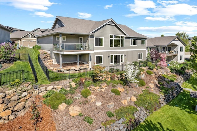 4305 S Bernson Ln, Spokane, WA 99223 - rear view of property with a balcony and board and batten siding