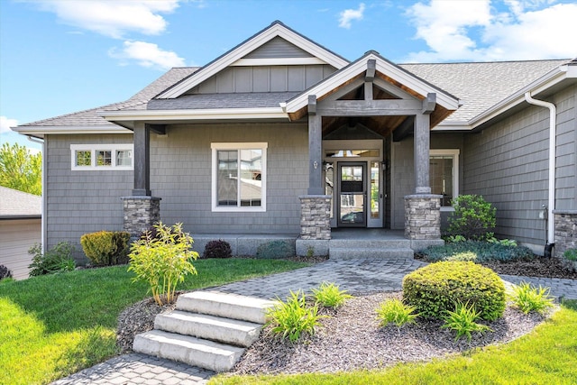 4305 S Bernson Ln, Spokane, WA 99223 - view of front of house featuring roof with shingles, a front lawn, and board and batten siding