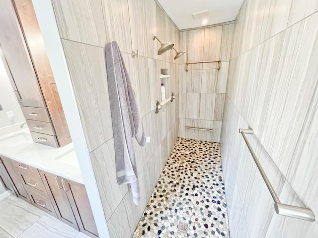 1602 S Canyon Woods Ln, Spokane, WA 99224 - full bathroom featuring tiled shower, vanity, and tile walls