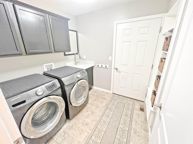 1602 S Canyon Woods Ln, Spokane, WA 99224 - laundry room featuring cabinet space, washing machine and clothes dryer, and baseboards