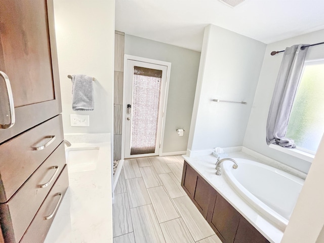 1602 S Canyon Woods Ln, Spokane, WA 99224 - full bathroom with a garden tub and vanity